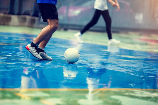 Futsal player run to shoot ball youth futsal league person