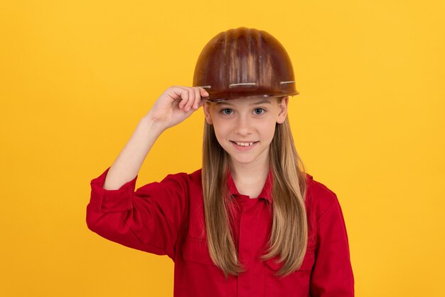 Future career of teen girl in helmet builder with concept of childhood development, happy labour day.