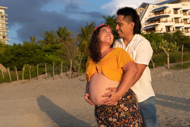 Future parents couple at sunset