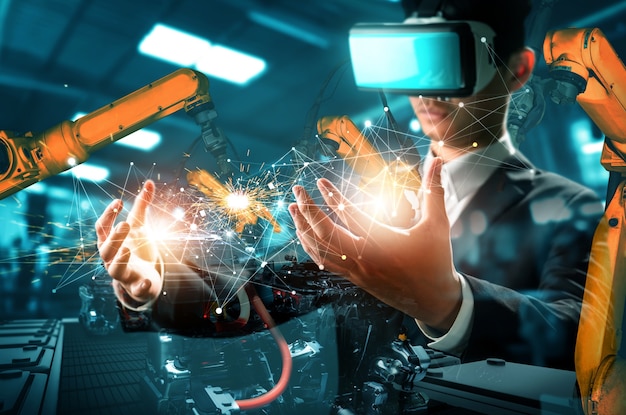 La futura tecnologia vr per il controllo meccanizzato del braccio robotico dell'industria