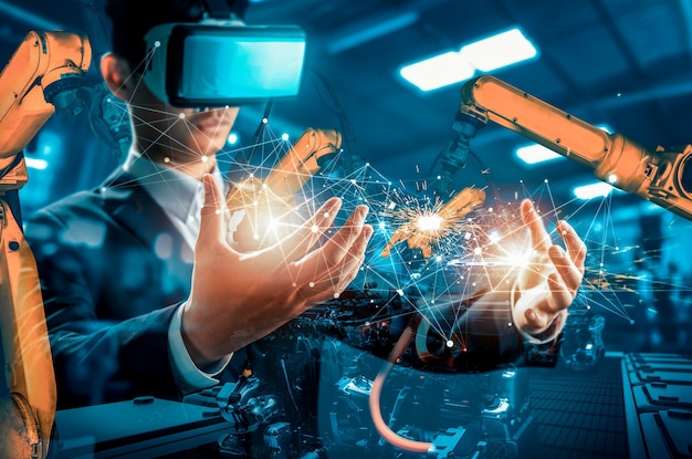 La futura tecnologia vr per il controllo meccanizzato del braccio robotico dell'industria