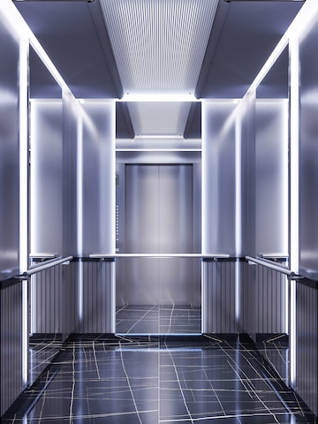  Futuristic design of an elevator cabin with mirrors with neon illumination and metal panels. modern