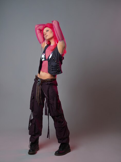 Futuristic fashion a young bright and attractive woman with pink hair