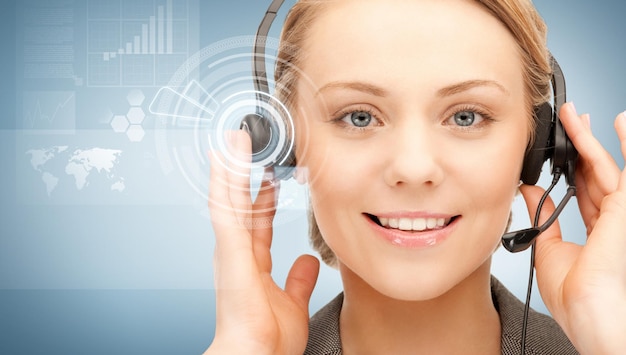 futuristic female helpline operator with headphones and virtual screen