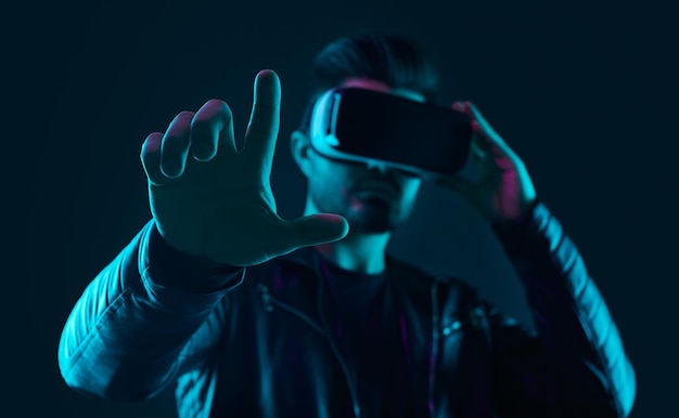 Futuristic man interacting with virtual reality