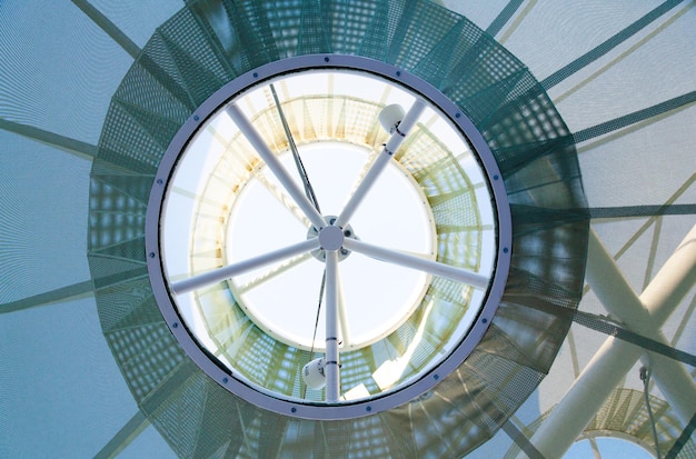 Futuristic tvan mesh roof with a steel frame viewed from below