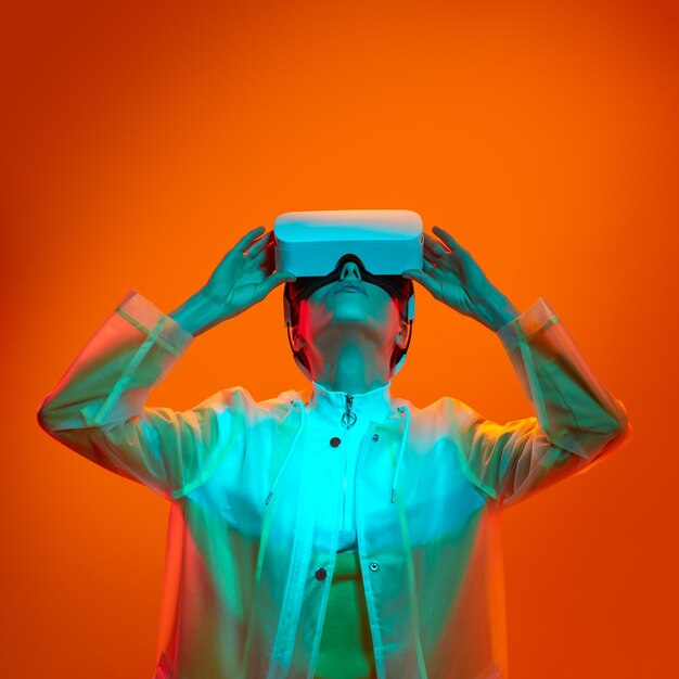 Futuristic woman exploring virtual reality