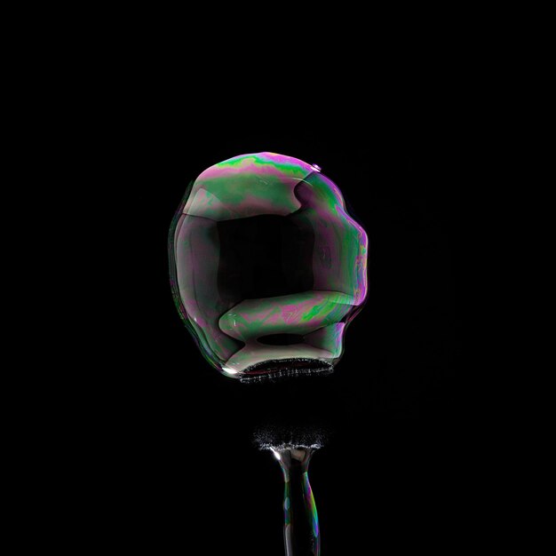 fyling Soap Bubble in colorful colors on black background