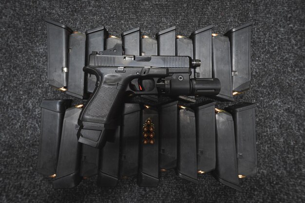 G19 pistol with red dot and loaded magazines