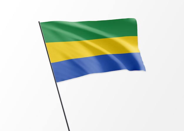 Gabon flag flying high in the isolated background. Gabon independence day