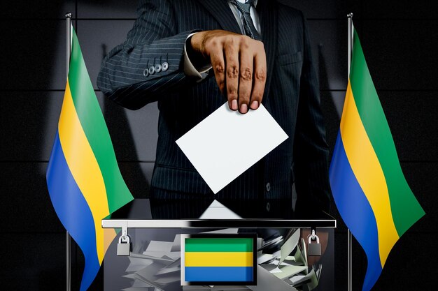 Foto bandiere del gabon che fanno cadere a mano il concetto di elezione della carta di voto illustrazione 3d