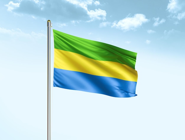 Gabon national flag waving in blue sky with clouds Gabon flag 3D illustration