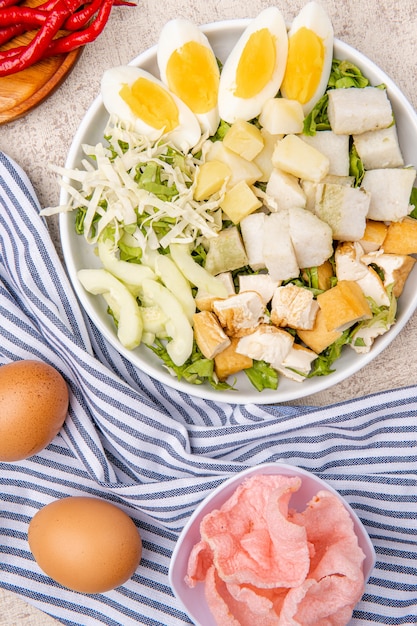 gado gado is an indonesian salad of slightly boiled blanched or steamed vegetables