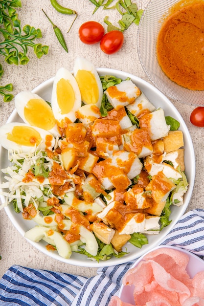 gado gado is an indonesian salad of slightly boiled blanched or steamed vegetables
