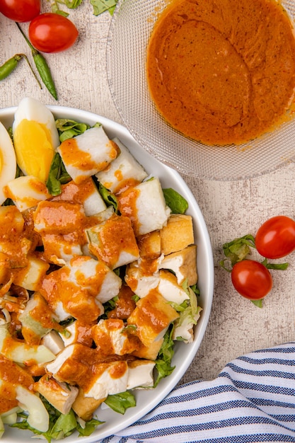 gado gado is an indonesian salad of slightly boiled blanched or steamed vegetables