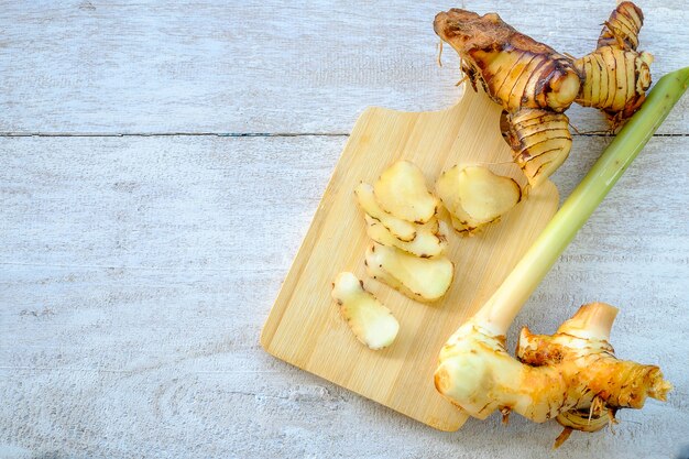  Galangal on a wooden cutting board