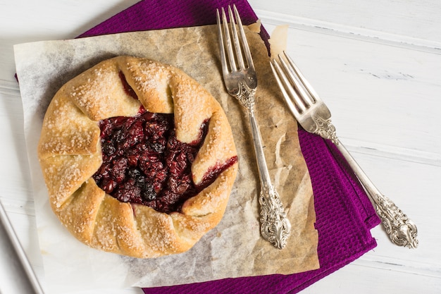 galette, berries, raspberry, blueberry, blackberry. pie on parchment paper. 