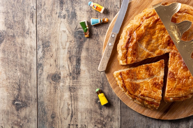 Galette des rois on wooden table. Traditional Epiphany cake in France