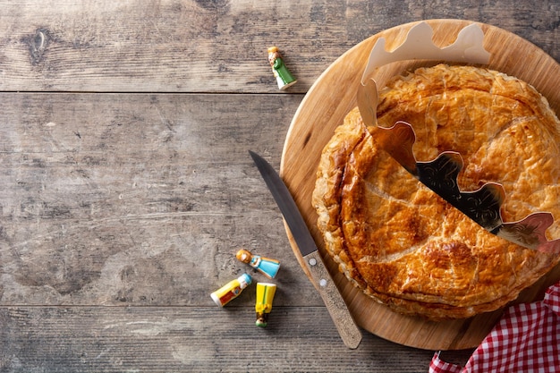 Photo galette des rois on wooden table.traditional epiphany cake in france