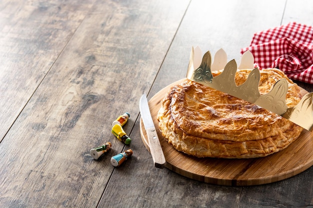 Galette des rois on wooden table.Traditional Epiphany cake in France