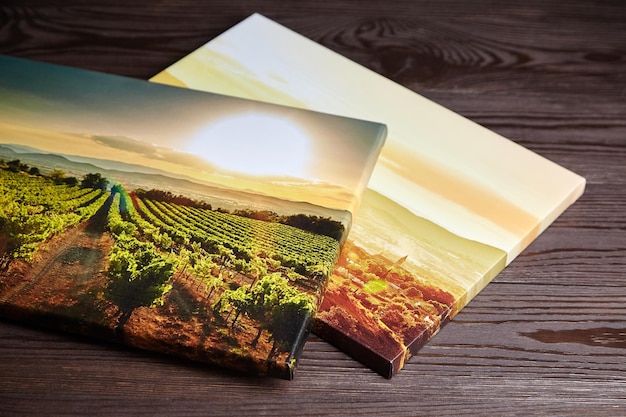 Photo gallery wrapped canvas photo prints on wooden table
