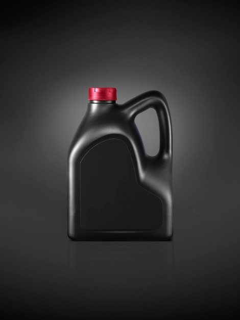 Gallon of engine oil on a dark black background