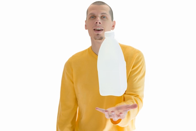 A gallon of milk flying above men's hand isolated on a white background Plastic Liquid Male Man Milk Levitate Fly