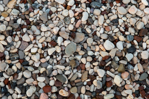 Galyaka on the beach, small colored pebbles, background, copy space.