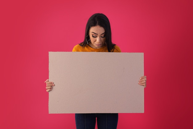 Gama,Distrito Federal, October 16, 2021, young woman holds advertising boards with facial expressions.