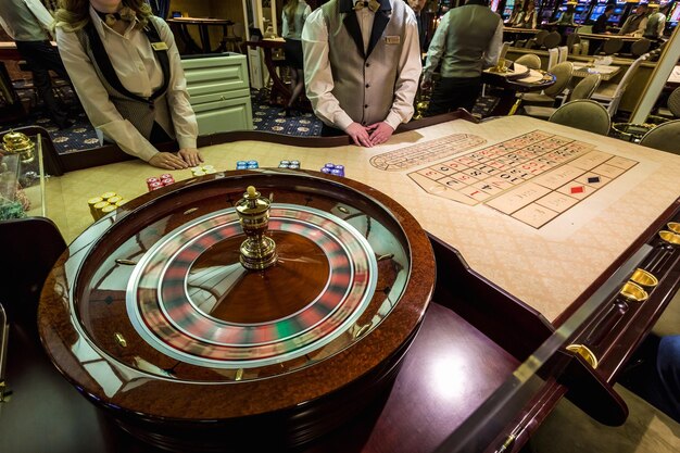 Photo gambling chips on a game table roulette