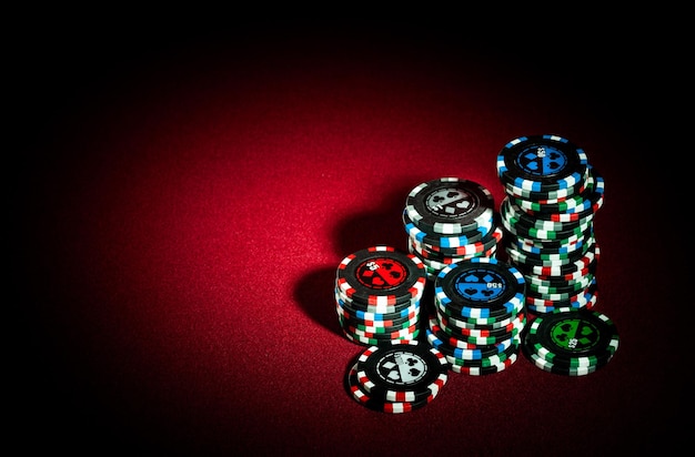 Premium Photo | Gambling chips on the red background