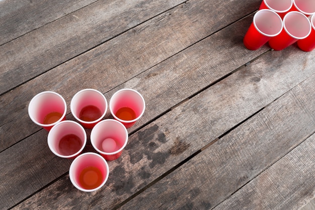 Game Beer Pong on wooden table