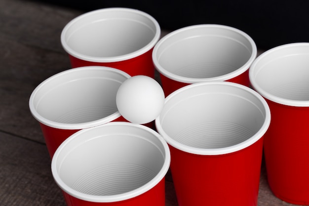 Game Beer Pong on wooden table