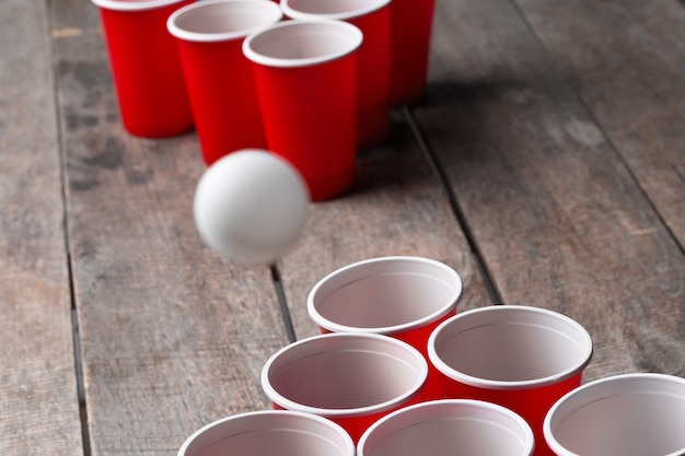 Game Beer Pong on wooden table