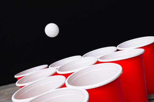 Game Beer Pong on wooden table