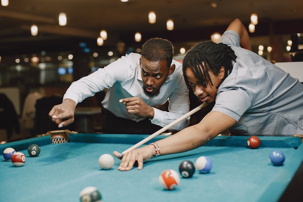Game of billiards. Men with a cane. Men's games