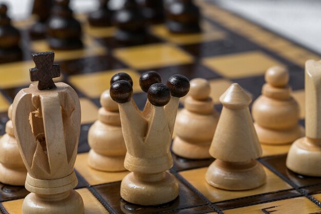 Game and chess pieces on white background