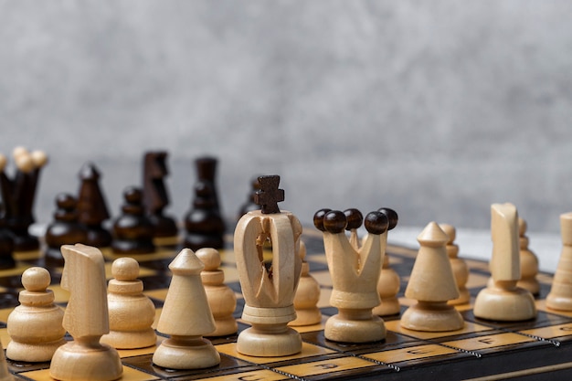 Game and chess pieces on white background