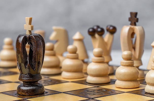 Game and chess pieces on white background