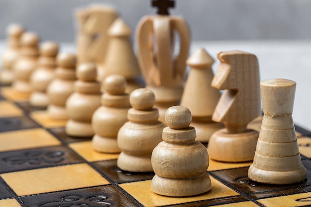 Game and chess pieces on white background