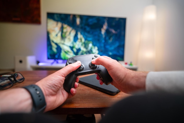game console home entertainment front person view gamepad TV screen living room interior