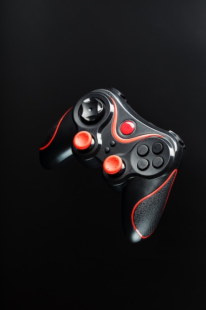 Game controller gamepad on black surface