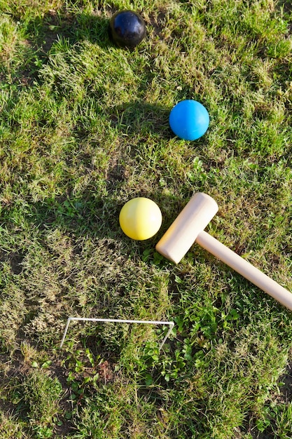 Game of croquet on green lawn