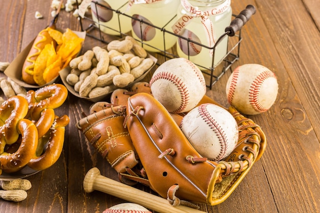 Game day traditional snacks included corndogs and salted peanuts on a wood board.