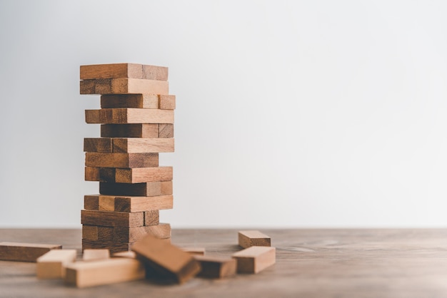 Game drew to a wooden block from the tower.concept business risks in the business. Requires planning meditation must be careful in deciding to reduce the risk in the business.