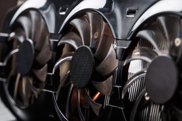 Game video card Cooler blades Selective close-up focus. Progressive cooling system for the video chip, processor and memory. Computer Details