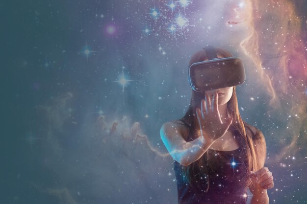 Gamer helmet on gamer girl in virtual reality on space galaxy backgroundElement of the image provided by NASA