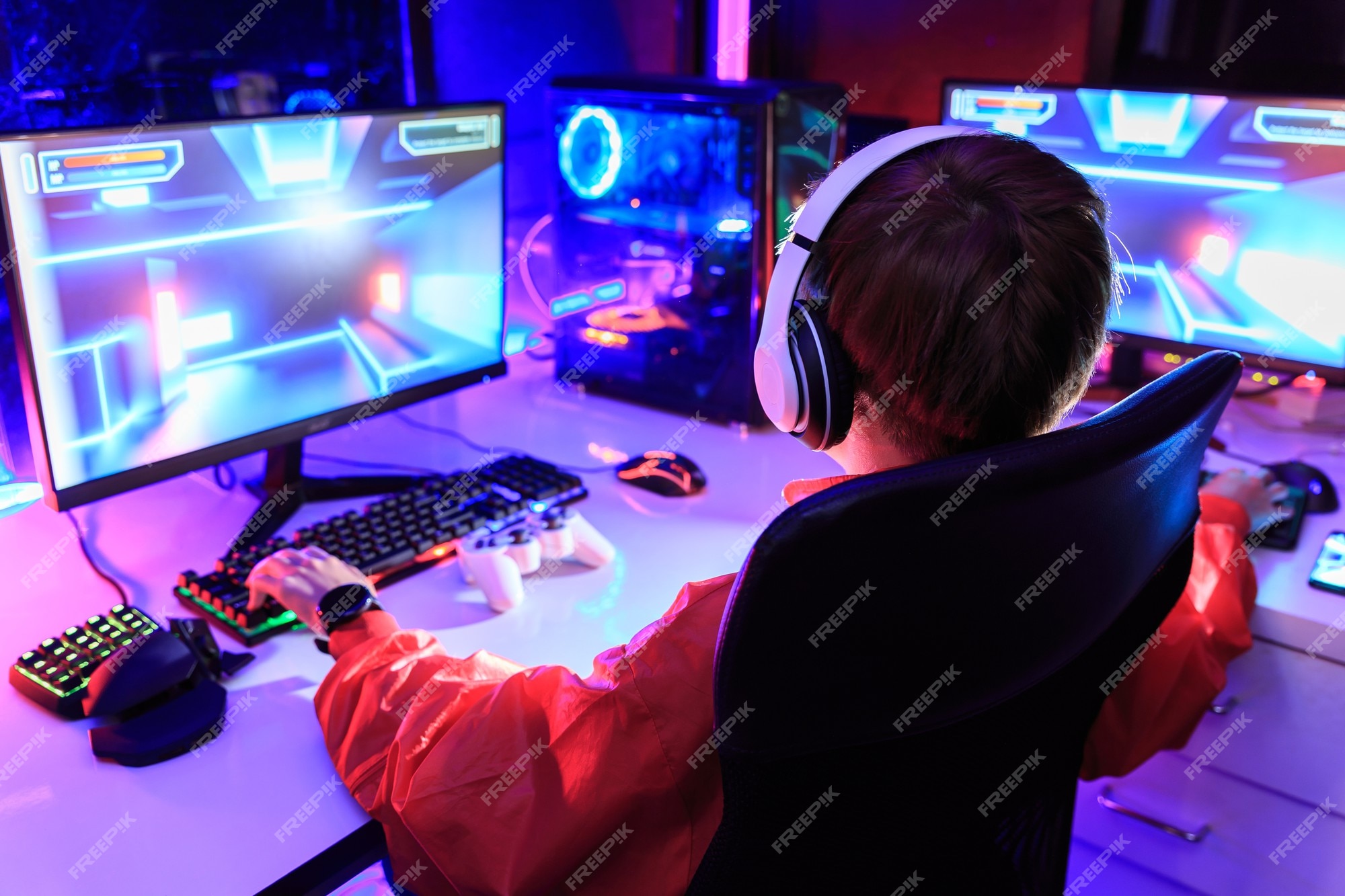 Premium Photo  Gamer playing online game on pc in dark room.