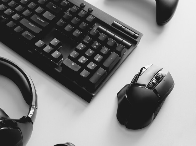 Gaming desk with keyboard, mouse and headphones