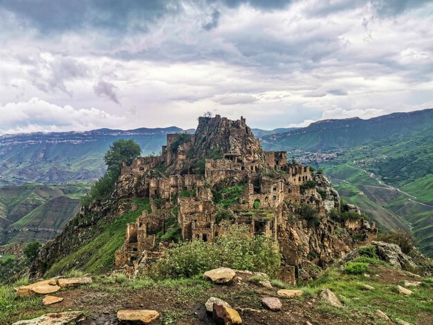 Gamsutl village in the Caucasus mountains Old stone buildings on top of a cliff Dagestan Russia June 2021